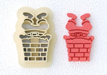 Santa Claus mold stuck in chimney