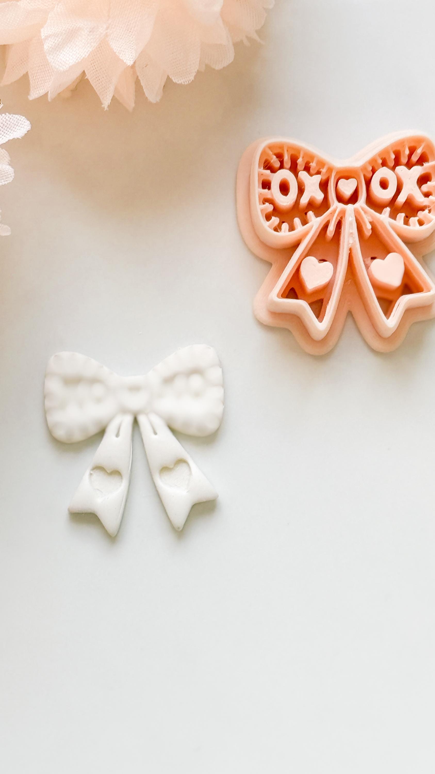 XOXO Bow Clay Cutter: Heart Ribbon Design with Script Embossing