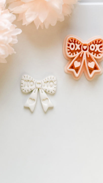 XOXO Bow Clay Cutter: Heart Ribbon Design with Script Embossing