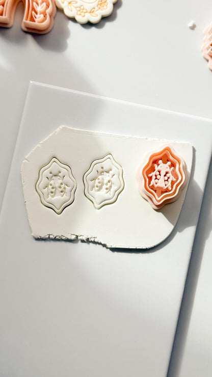 Lucky Lady Polymer Clay Cutter: Embossed Ladybug in Wavy Frame