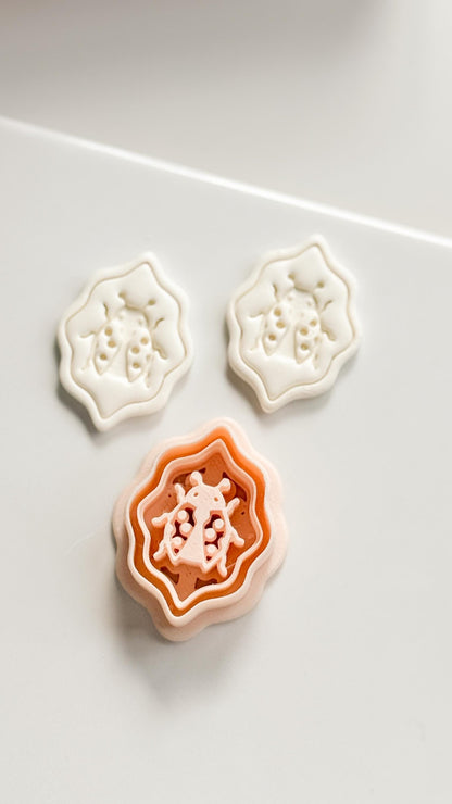 Lucky Lady Polymer Clay Cutter: Embossed Ladybug in Wavy Frame