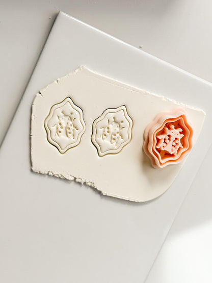 Lucky Lady Polymer Clay Cutter: Embossed Ladybug in Wavy Frame