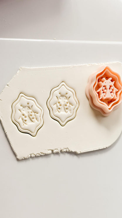 Lucky Lady Polymer Clay Cutter: Embossed Ladybug in Wavy Frame