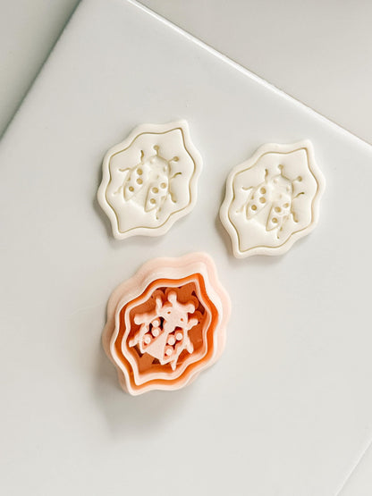 Lucky Lady Polymer Clay Cutter: Embossed Ladybug in Wavy Frame